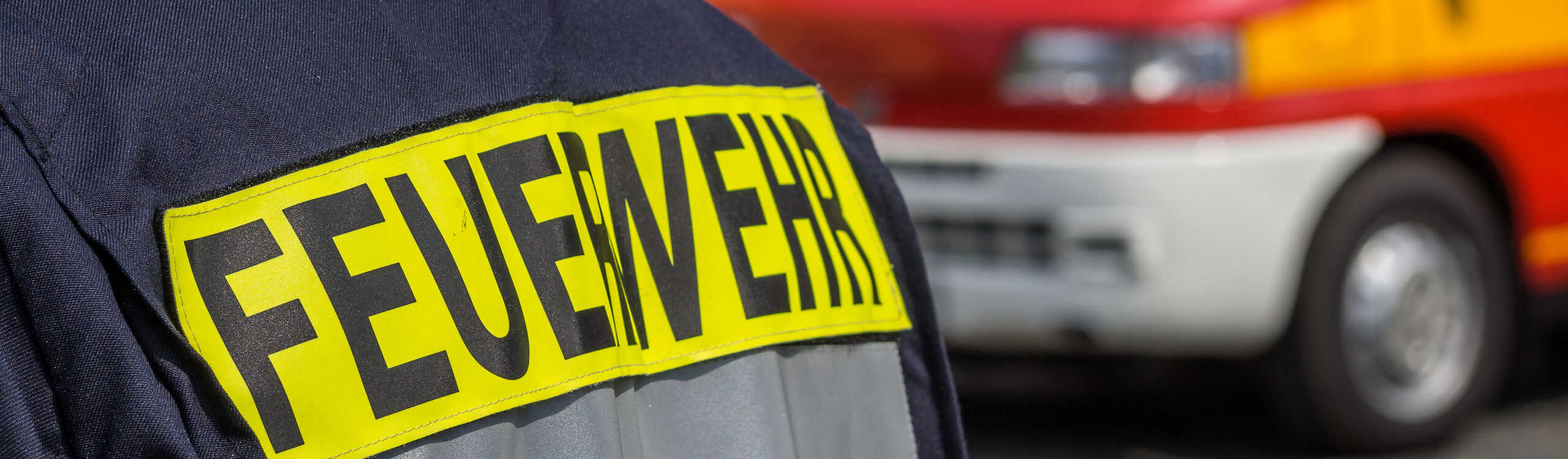 Fireman with rescue vehicle in the background